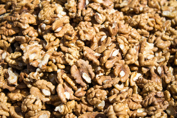 Walnuts are scattered on the table. Background for design