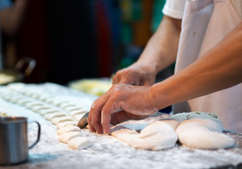 hands kneading dough