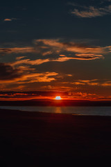 Fototapeta na wymiar beautiful evening sunset over the horizon, vertical photo