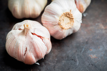 Garlic close-up shot on the rustic background. Selective focus. Shallow depth of field.