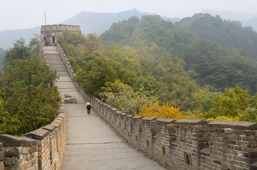 Female tourist heading east to tower 8 on the Mutianyu Great Wall of China north of Beijing