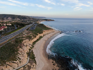 Aerial view of Newport Beach, cliff and beach during sunset twilight in southern California, USA