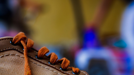 Sneakers close up. Shoelace of sport shoes macro texture. Shoes on wood board.