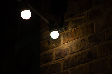 lights by the brick wall