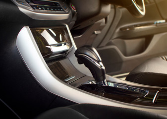 Obraz na płótnie Canvas Put a gear stick into P position (Parking) on automatic transmission in a luxury car.
