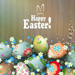 Easter composition with a silhouette of a board, multi-colored eggs with a diverse pattern, flowers and willow branch