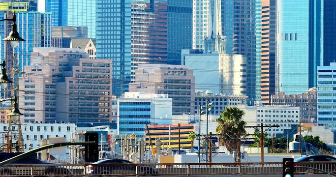 Heat distorsion from cars over freeway on purpose - Transportation traffic and Los Angeles downtown business and financial district towers skyscrapers skyline, California, 4K
