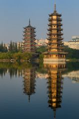 Sun and Moon Pagodas on Shanhu or Fir Lake in early morning Guilin China