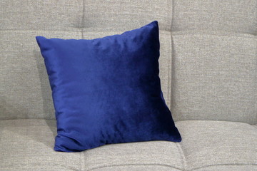 An image of a pillow lying on the couch.