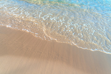 Tropical sea beach with sand and wave of the sea