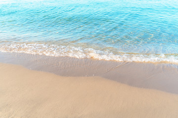 Fototapeta na wymiar Tropical sea beach with sand and wave of the sea