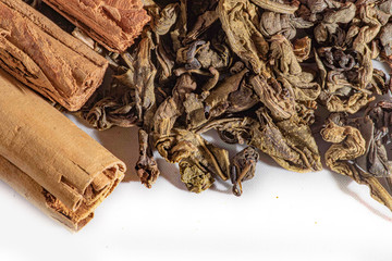 Cinnamon stick with ceylon green tea leaves - sri lankan green tea - gun powder