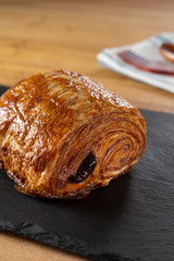 A closeup view of a French pastry called a pain au chocolat.