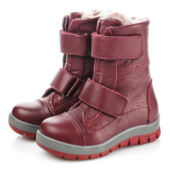 Red children's winter boots for girls isolated