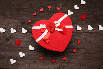 The cover of the box in the shape of a heart. Valentines day concept with hearts and gift box. Top...