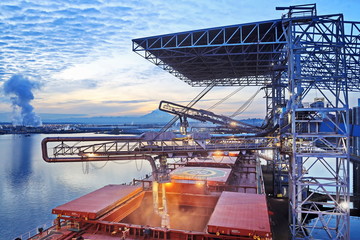 Night views of cargo terminal for loading grain cargo by shore cranes. Port Tacoma,WA, USA....