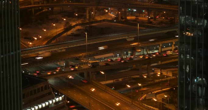 timelapse of a city road junction in Moscow at night. night traffic in the city. panorama of the transport interchange of the big city at night. 4k H-264
