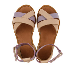 Beige sandals for girls with gray inserts isolated on white. Top view