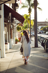 Young Women walking on the street of the shopping district in Santa Barbara California