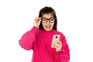 Adorable young girl with a mobile phone