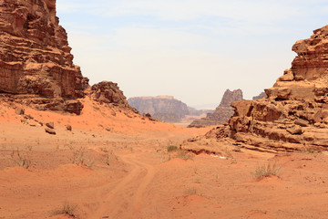 Fototapeta premium Wadi Rum desert panorama with dunes, mountains and sand that looks like planet Mars surface, Jordan