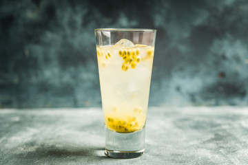 Passion fruit cocktail in highball glass. Selective focus. Shallow depth of field.