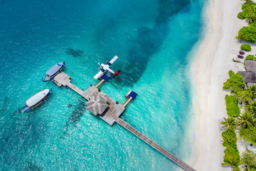 Aerial top view of bungalows in Maldives