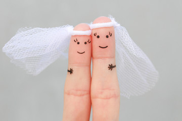 Fingers art of happy gay couple to get married. Concept of wedding ceremony.