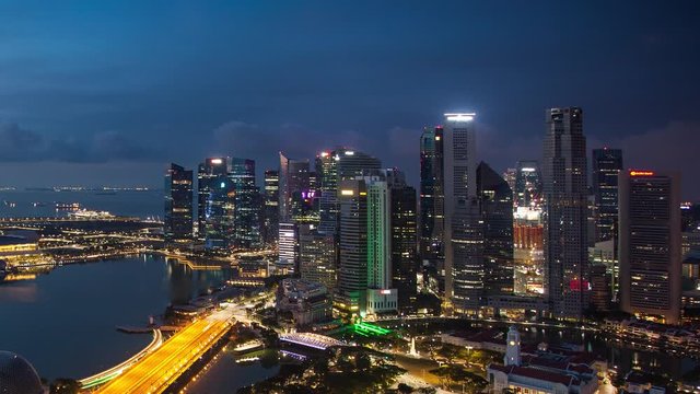 Time lapse of Singapore business district and city at twilight, Asia