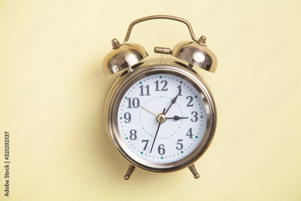 Canvas Prints Alarm clock on yellow background. Top view