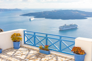 Beautiful panoramic view on the mediterranean sea, caldera and volcano. Traditional white architecture of Santorini island, Thira, Greece. Cruise ship in blue sea.