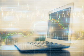 Financial market graph hologram and personal computer on background. Multi exposure. Concept of forex.