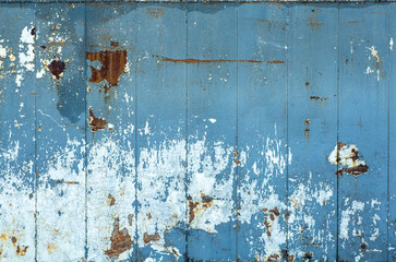 Old peeling paint texture on a wooden wall background. Pattern and texture of old dried paint and stucco on a rough surface