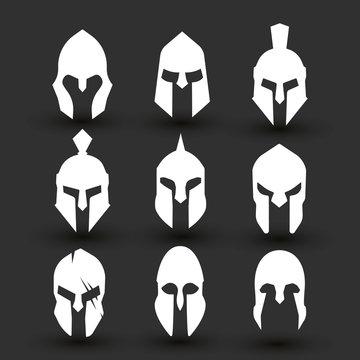 Silhouettes spartan helmet isolated from the black background. Vector set of roman or greek warrior helmet.