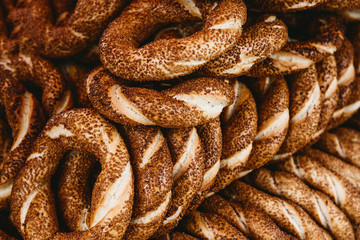 Close up of many traditional turkish bagels called simit. Traditional street food.