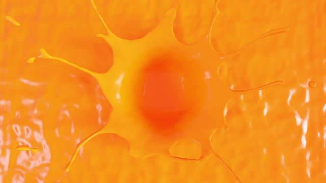splash from a drop of orange paint