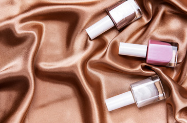 Nail polish bottles on silk