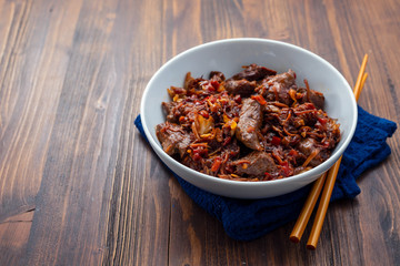meat with vegetables in white bowl