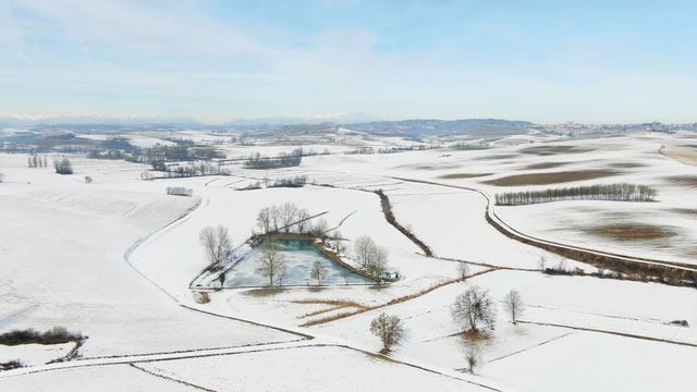 Aerial drone view of a snowy Monferrato