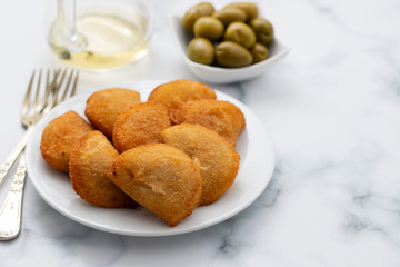 typical portuguese snack with meat rissois de carne on ceramic background