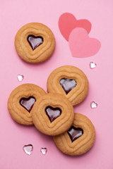 cookies with hearts on pink background