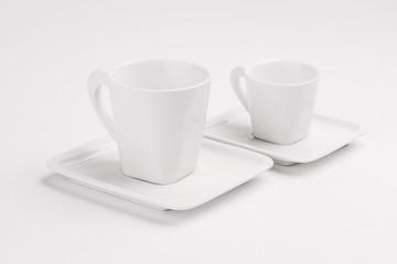 two empty cups isolated on white background