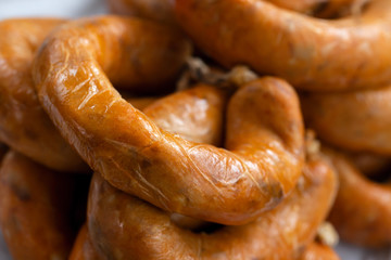portuguese smoked sausages alheira on paper
