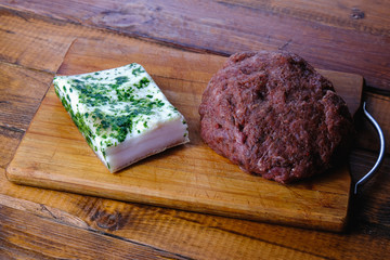 cooking pork sausages composition on a wooden background