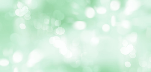 Abstract illustration of blurred light spots on green background.  Blurry summer backdrop 