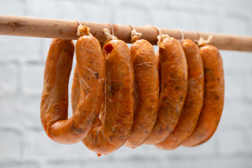 portuguese smoked sausages alheira on wooden stick