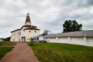 Fototapeta na wymiar Wall and dome of Ferapontov monastery in a summer day