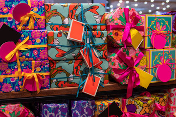 Multi-colored holiday boxes with gifts.