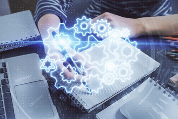 International business hud over woman's hands writing background. Concept of hard work. Double...