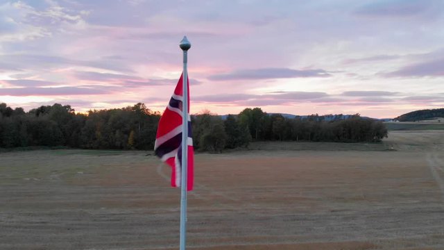 Norwegian flag at beautiful sunset